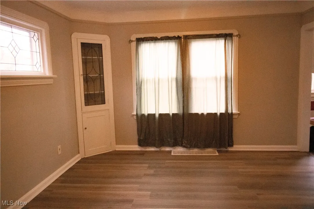 Dining room featuring baseboards and luxury vinyl wood finished floors