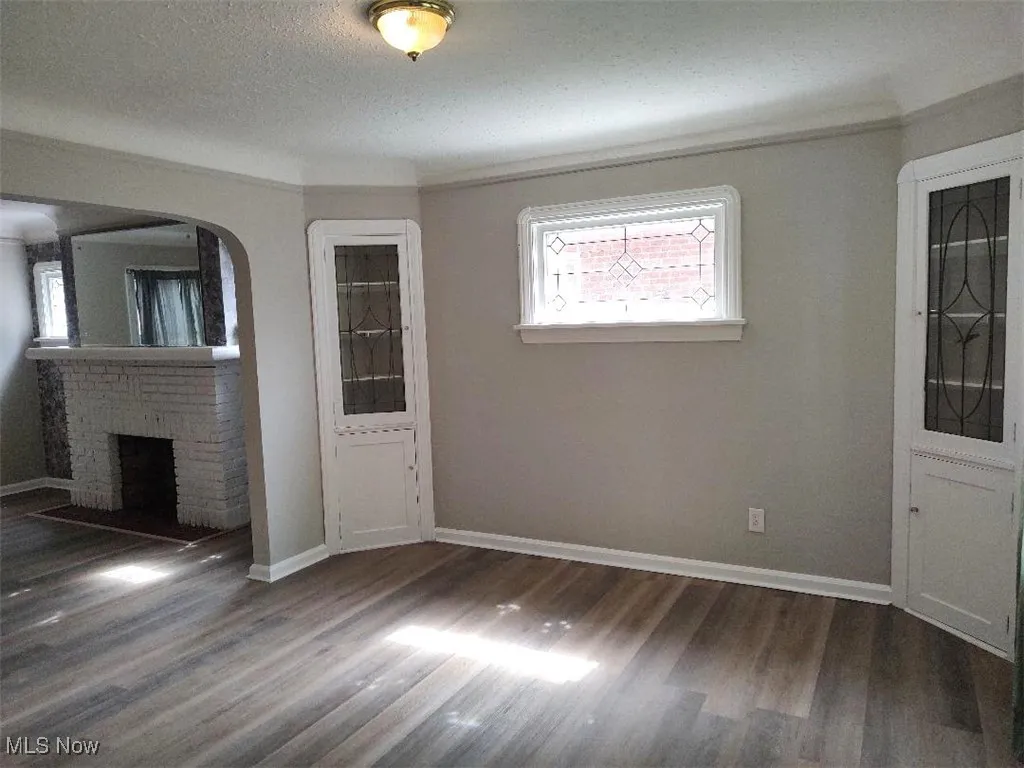 Dining room with lead glass window and built-in cabinets