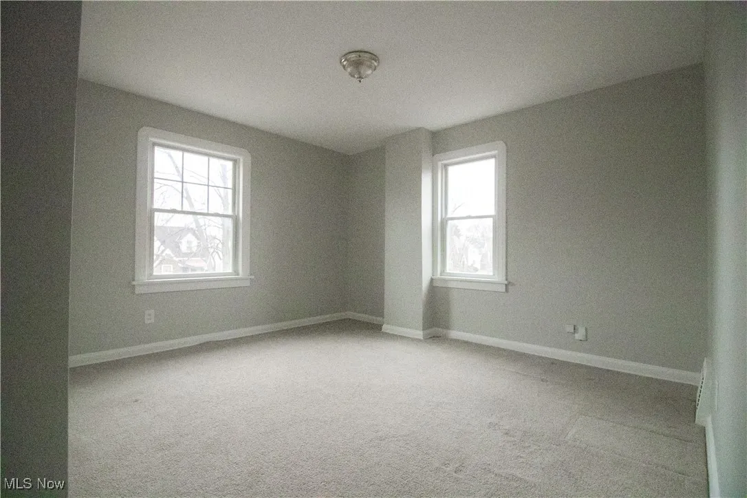 Carpeted bedroom room featuring baseboards