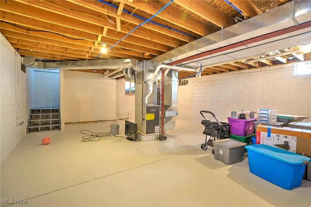 Below grade area featuring heating unit