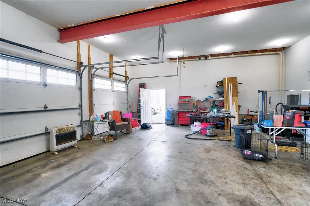 Garage featuring heating unit