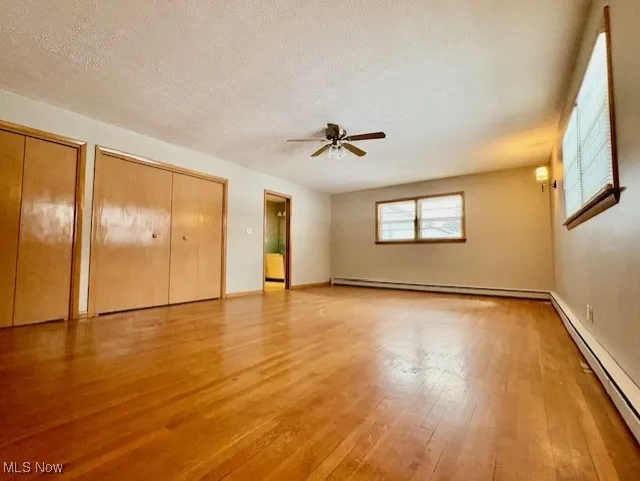 Owner's suite with 2 double closets and hardwood floors