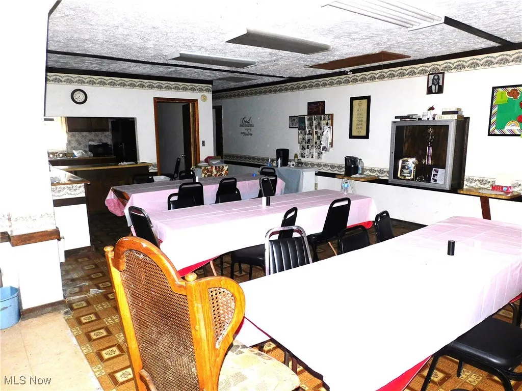 Dining area with a textured ceiling