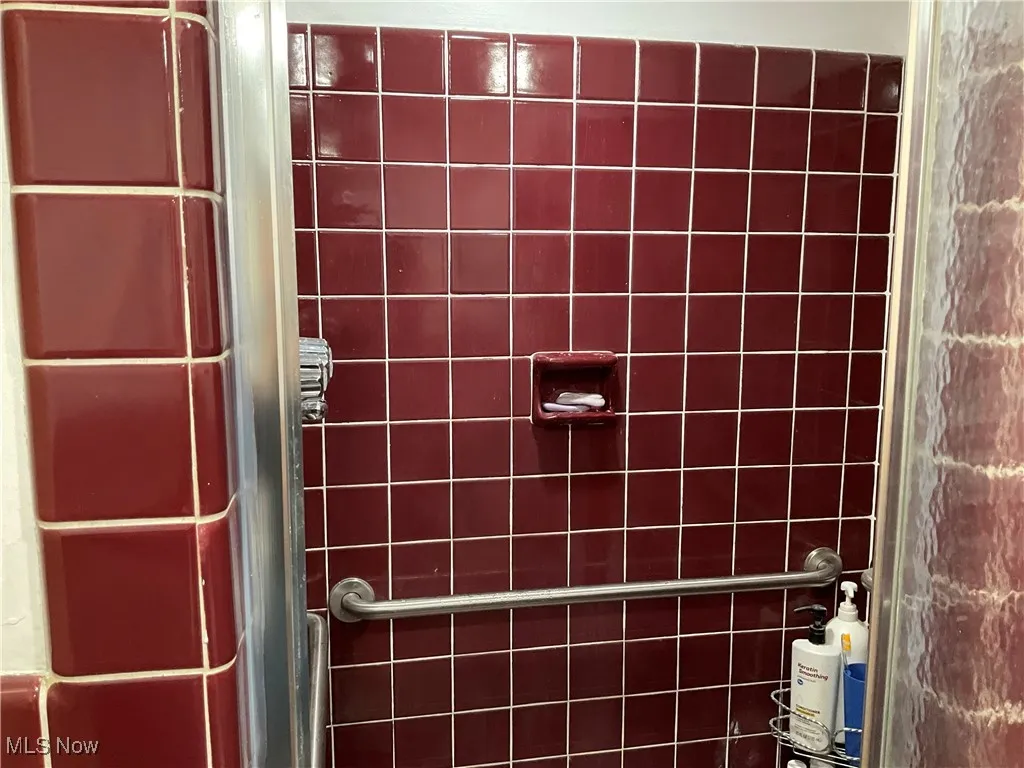 Room details with a shower stall