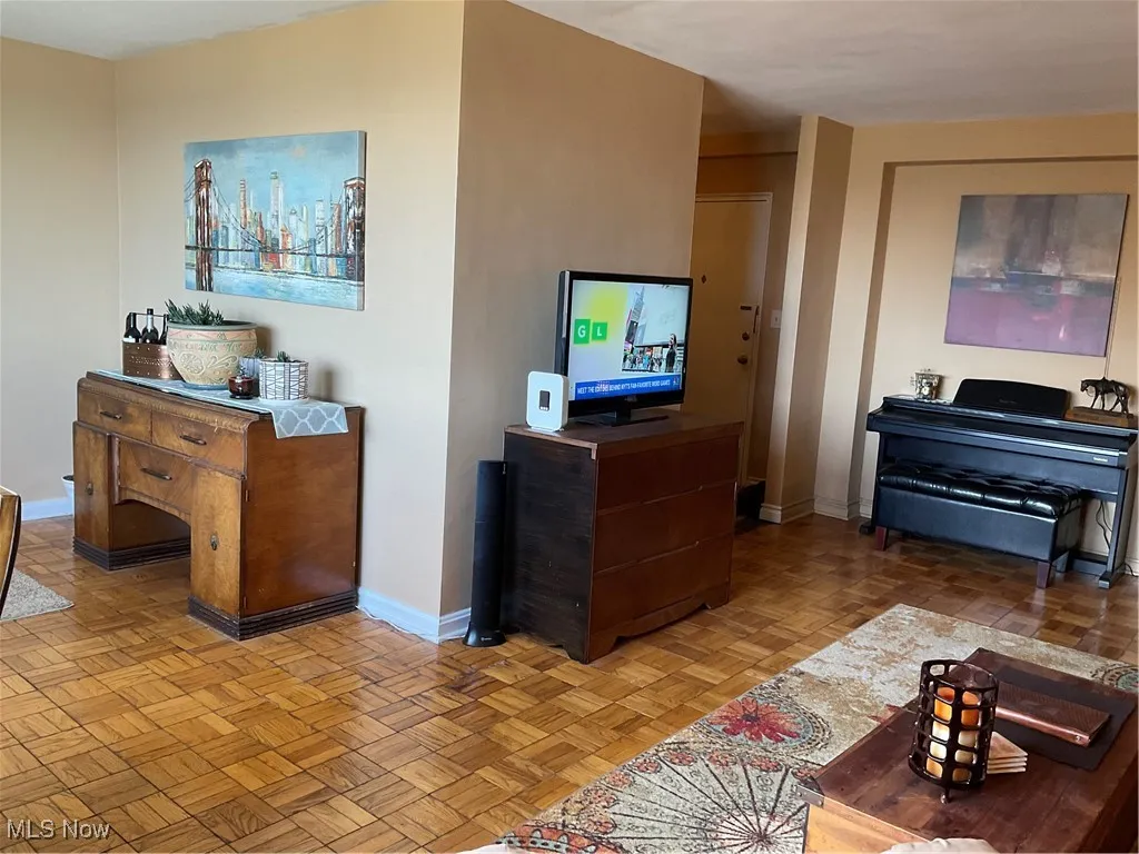 Living area featuring baseboards