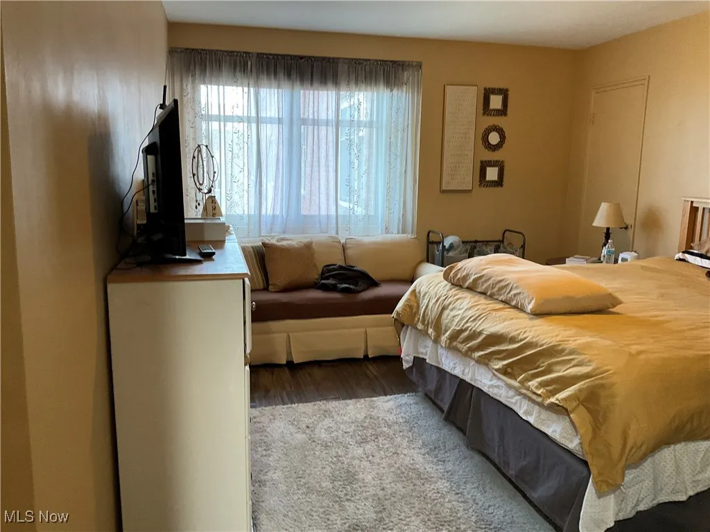 Bedroom with wood finished floors