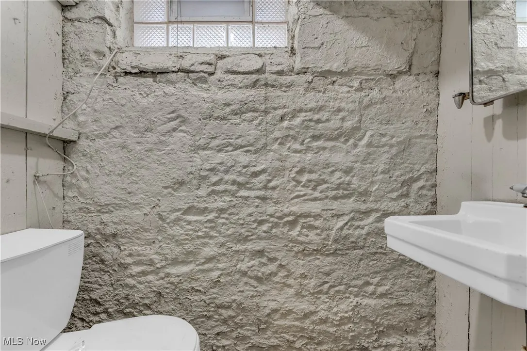 Bathroom with toilet and a sink