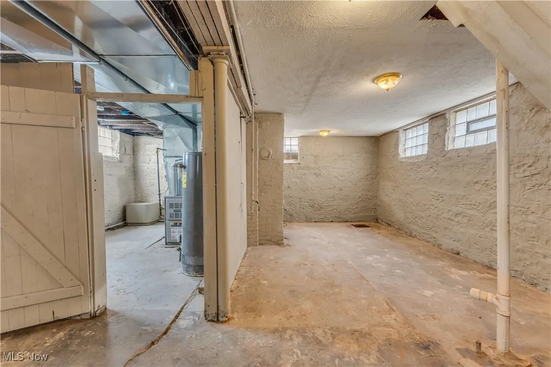Below grade area with a textured ceiling
