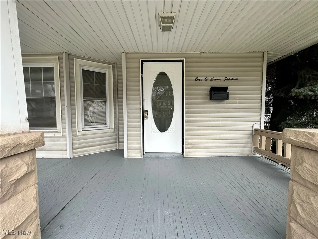 Entrance to property featuring a deck