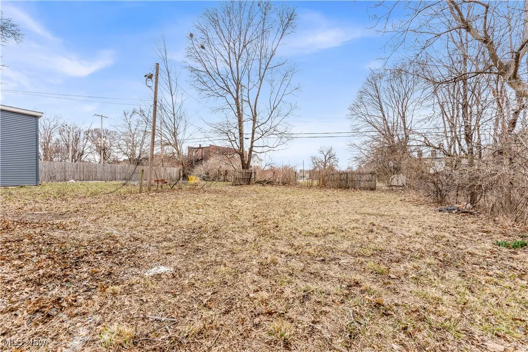 View of yard featuring fence