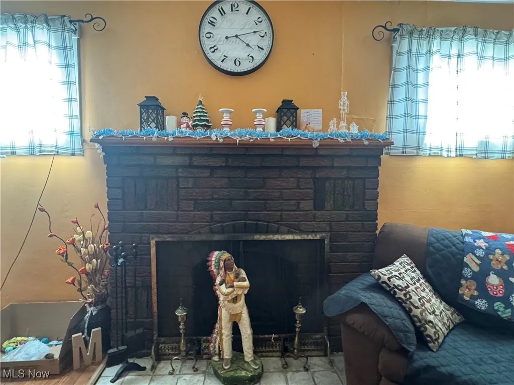Room details with a brick​​‌​​​​‌​​‌‌​‌‌​​​‌‌​‌​‌​‌​​​‌​​ fireplace
