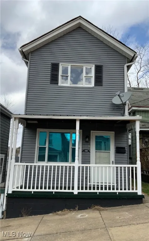 View of front of property featuring covered porch
