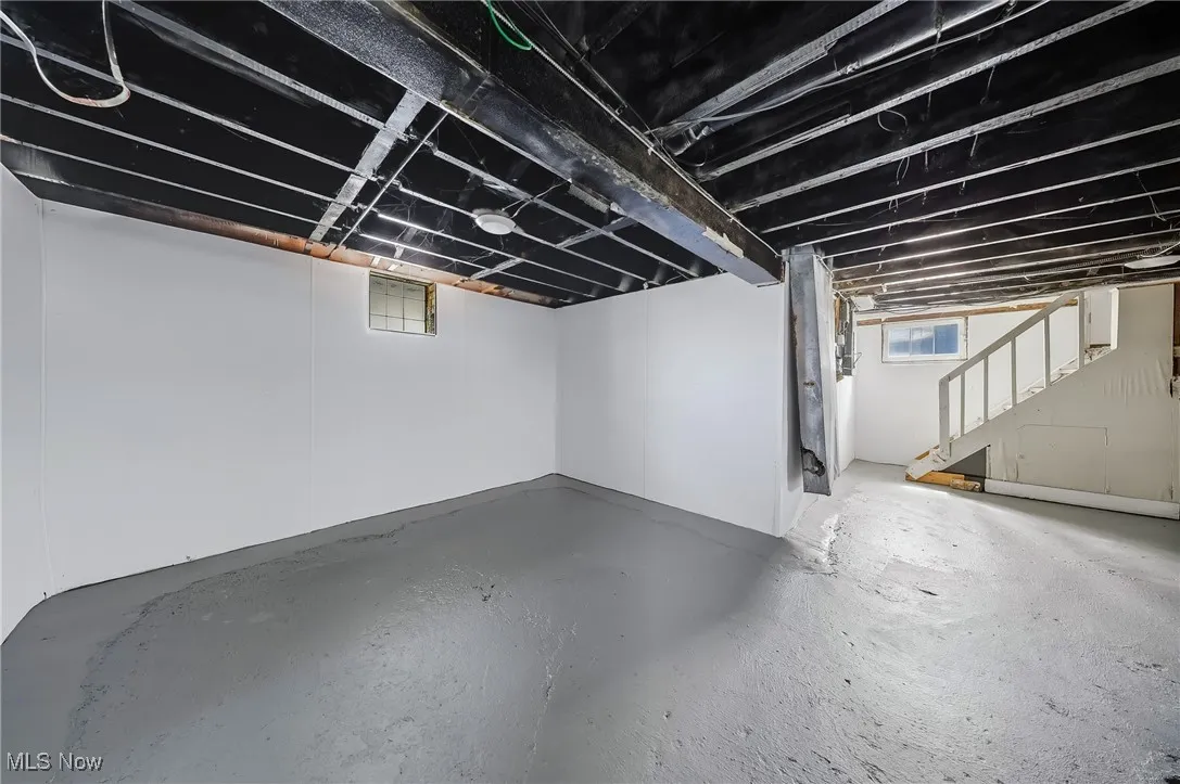 Below grade area featuring stairs