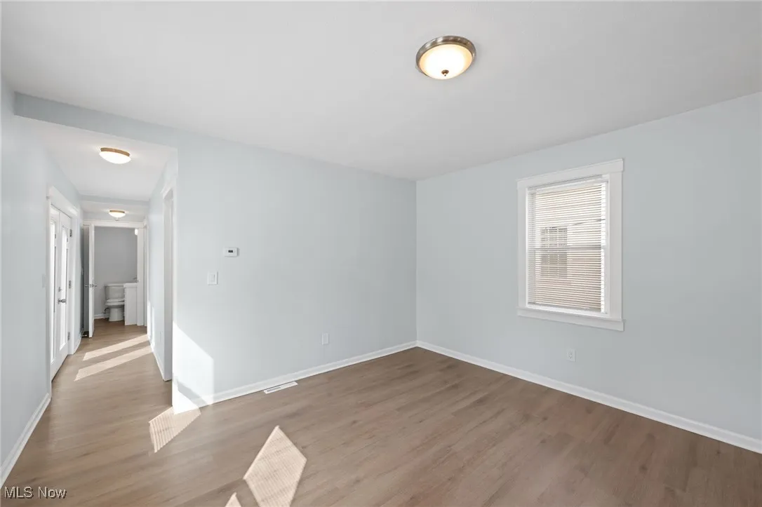 Hallway to bedrooms and half bath