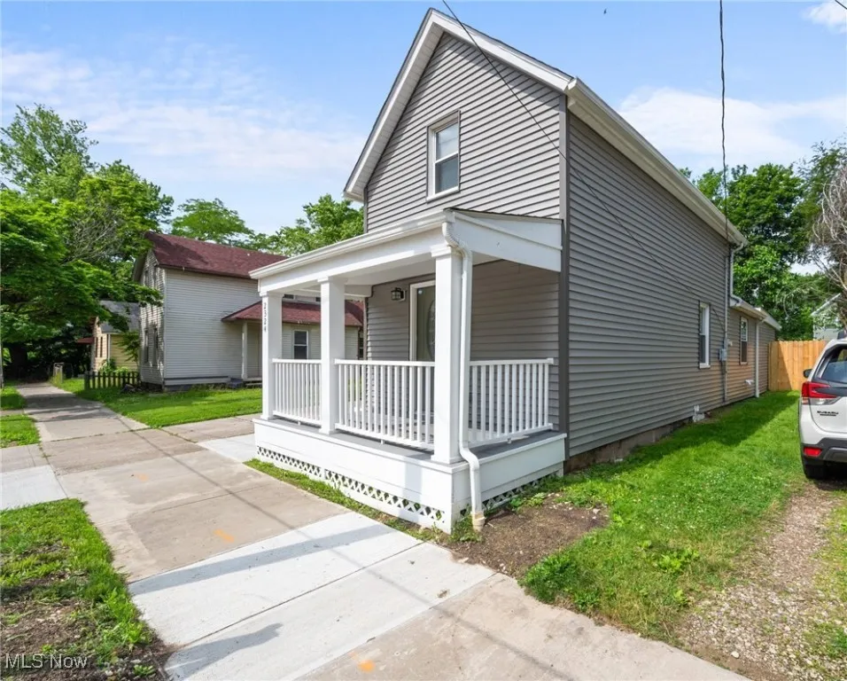 View of property exterior with covered porch
