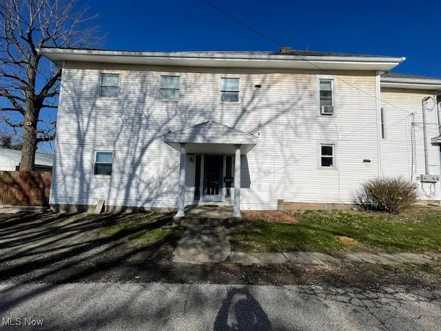 Back of house featuring fence