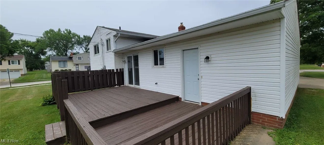 Wooden terrace with a yard