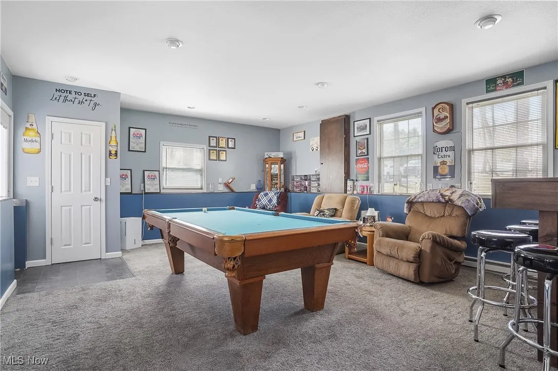 Recreation room with carpet flooring, billiards, and baseboards
