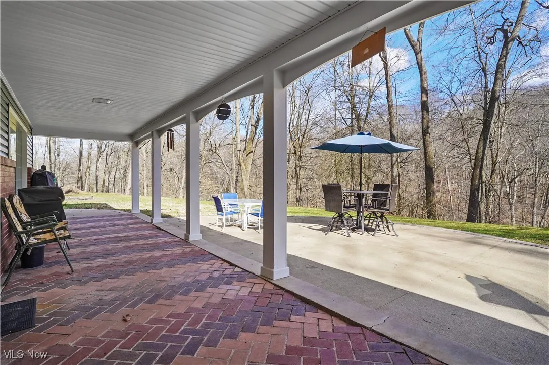 View of patio with outdoor dining area