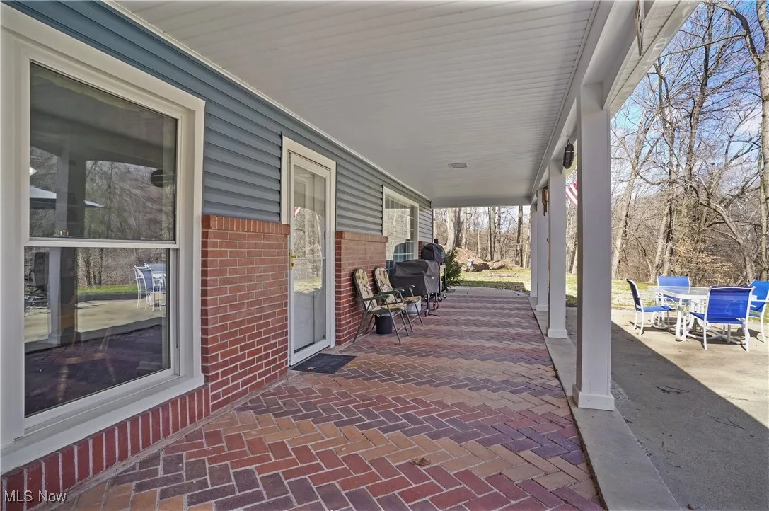 View of patio with a porch