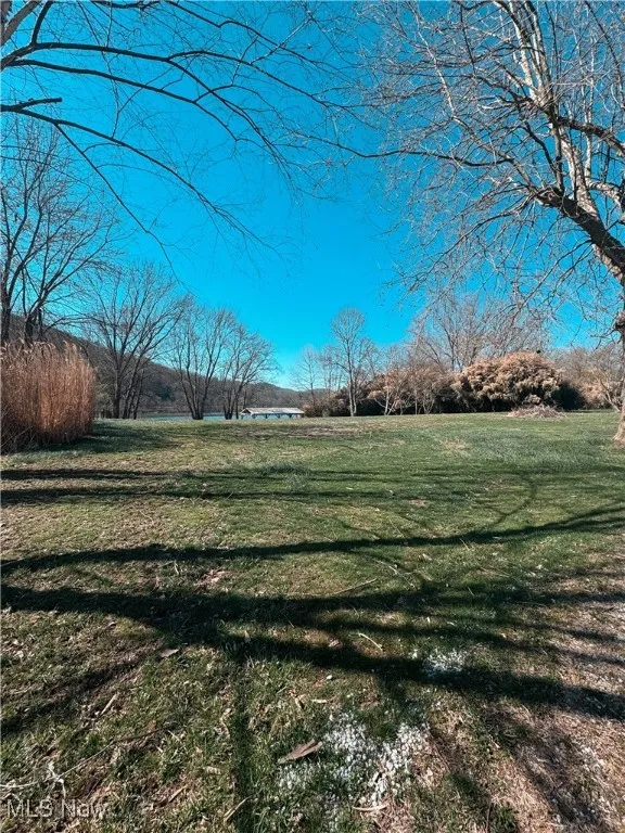 View of yard with a rural view