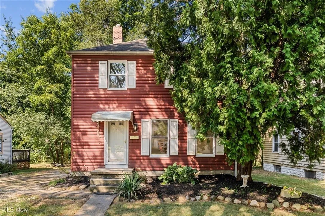 View of front of property featuring a chimney