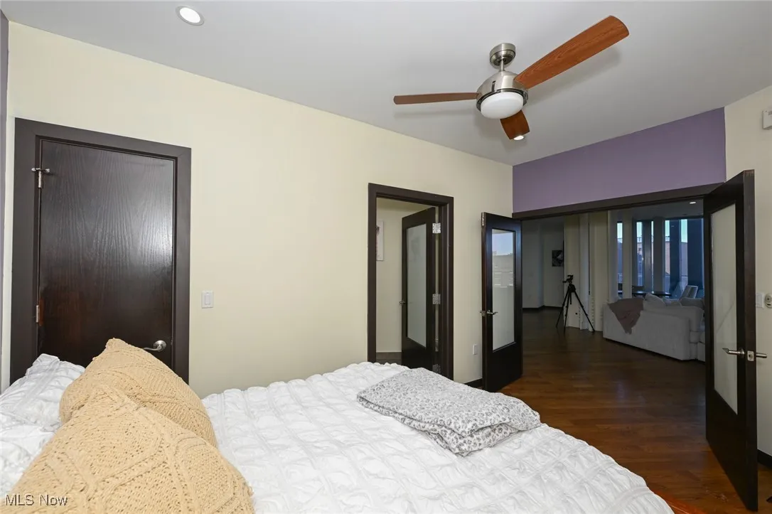 Bedroom with a ceiling fan and wood finished floors