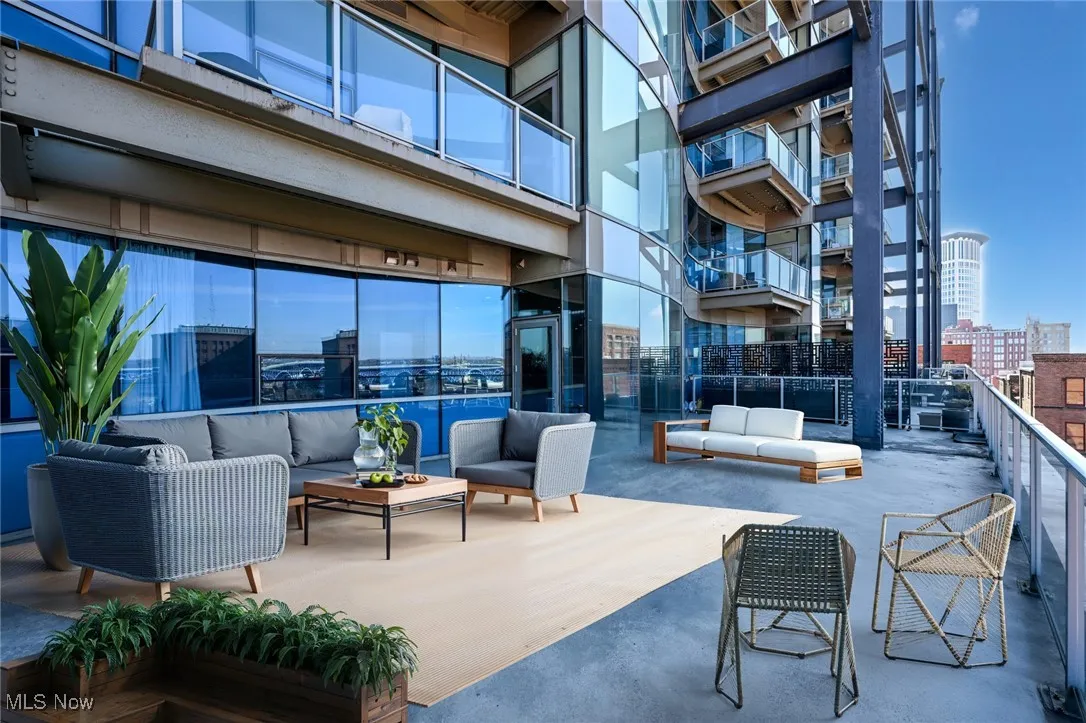 Virtually staged, View of patio / terrace featuring an outdoor hangout area and a city view