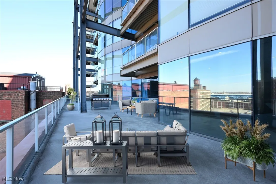 Virtually staged, View of patio featuring a balcony