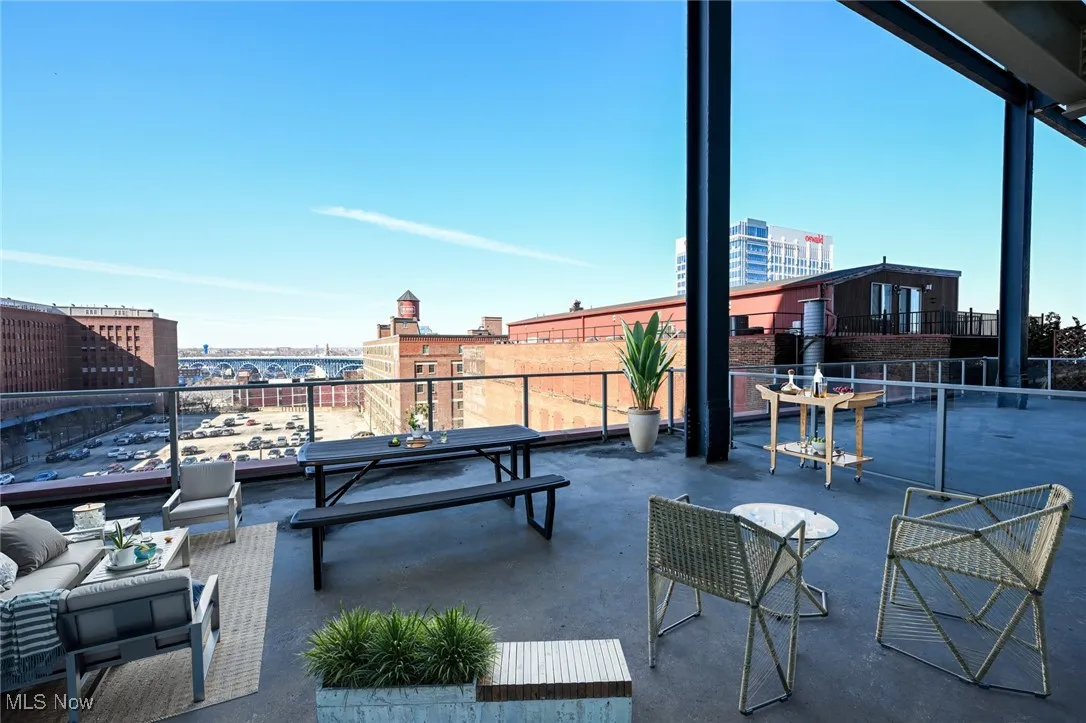 Virtually staged, View of patio with a balcony