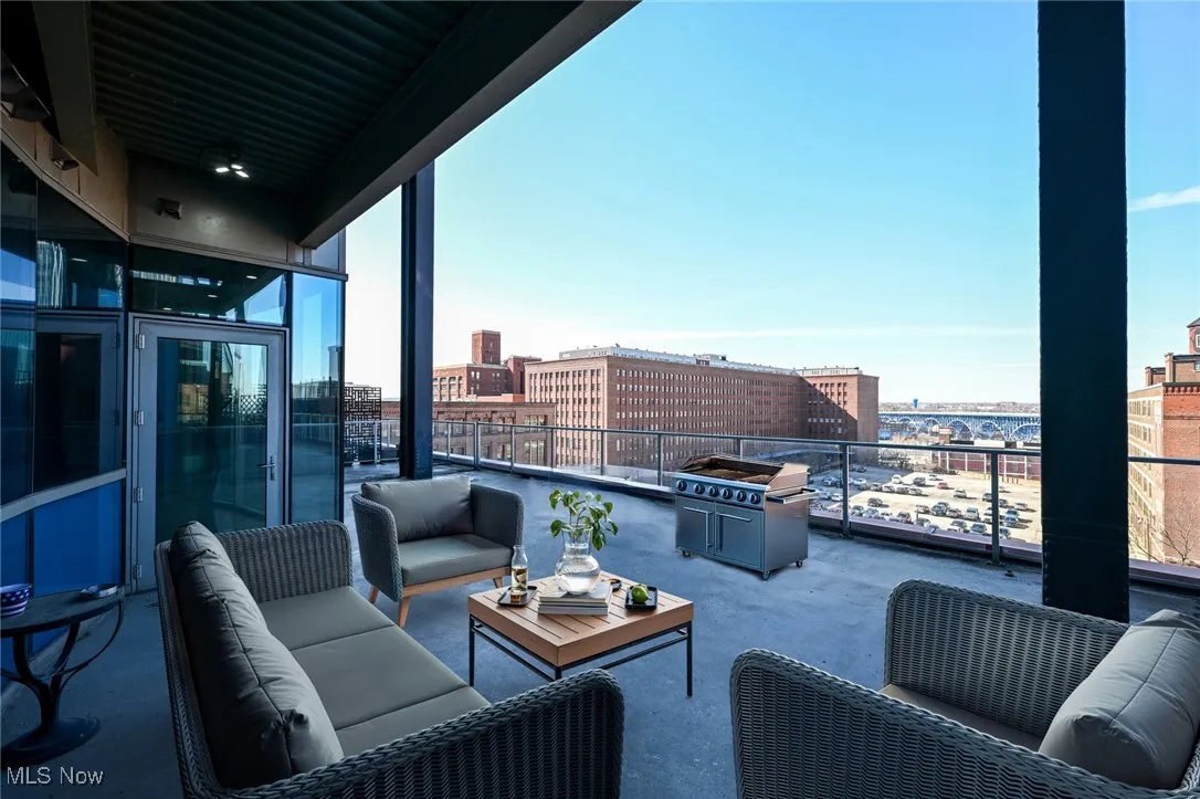Virtually staged, Balcony with area for grilling, an outdoor hangout area, and a view of city