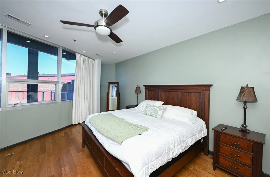 Bedroom featuring visible vents, wood finished floors, ceiling fan, and recessed lighting