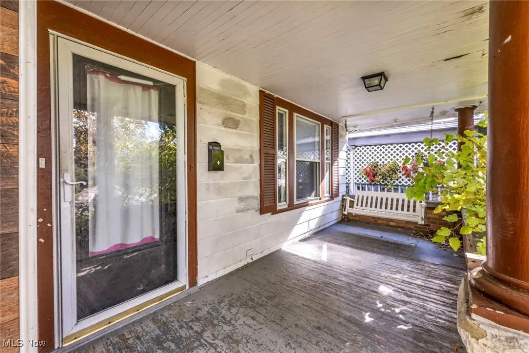 Property entrance featuring covered porch