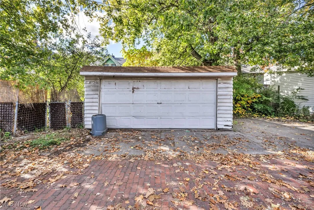 Detached garage featuring fence
