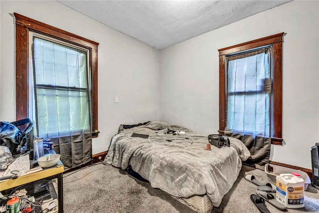 Bedroom with carpet floors and a textured ceiling
