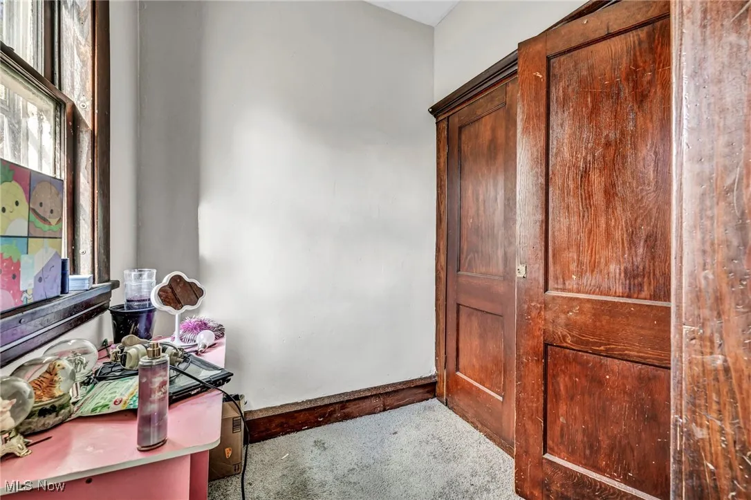 Carpeted office featuring baseboards