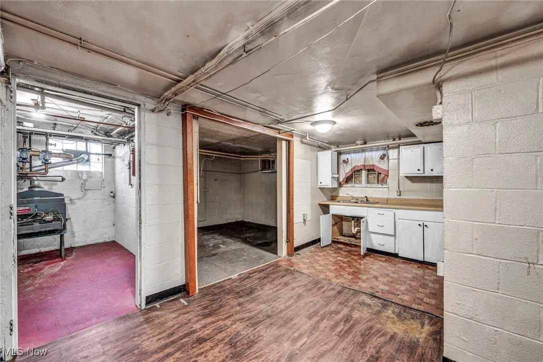 Below grade area with dark wood-style flooring