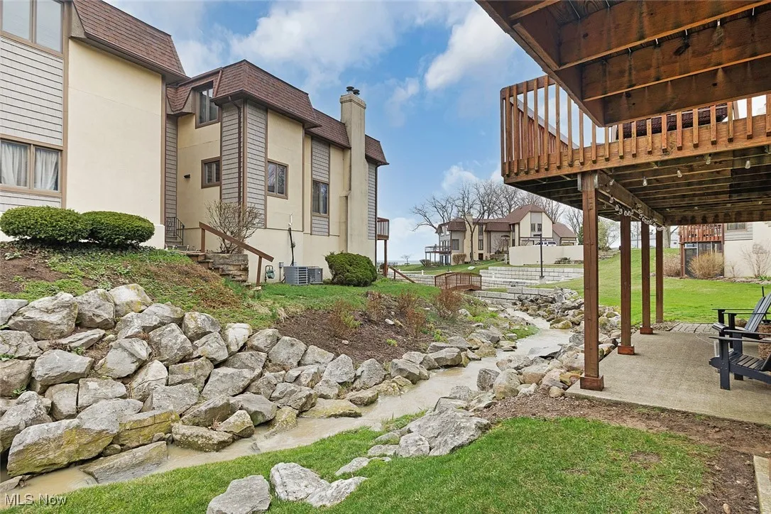 View of yard with central AC unit and a patio area