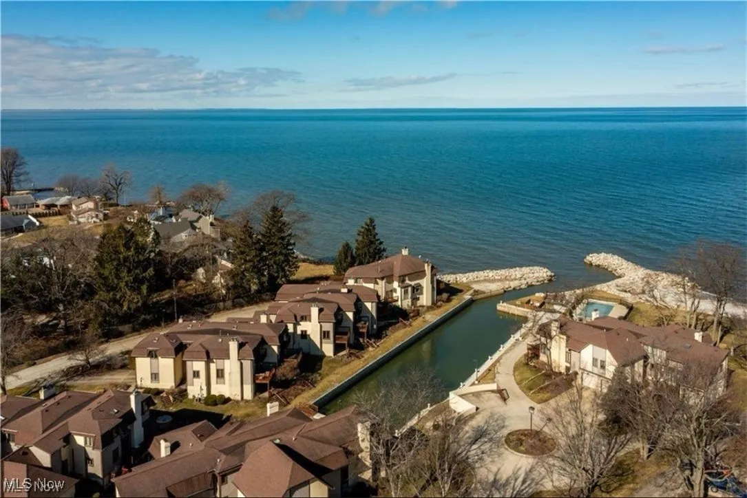 Drone / aerial view featuring a water view and a residential view