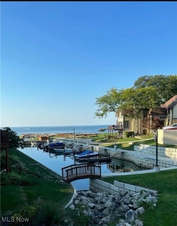 Dock area featuring a water view