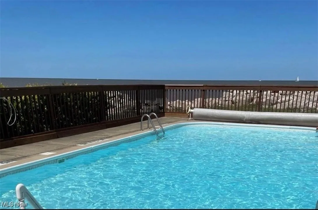View of pool with a fenced in pool