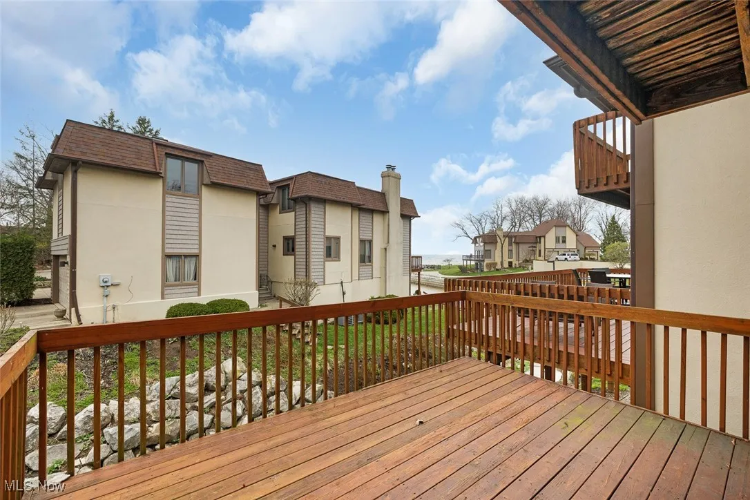 Wooden terrace featuring a residential view