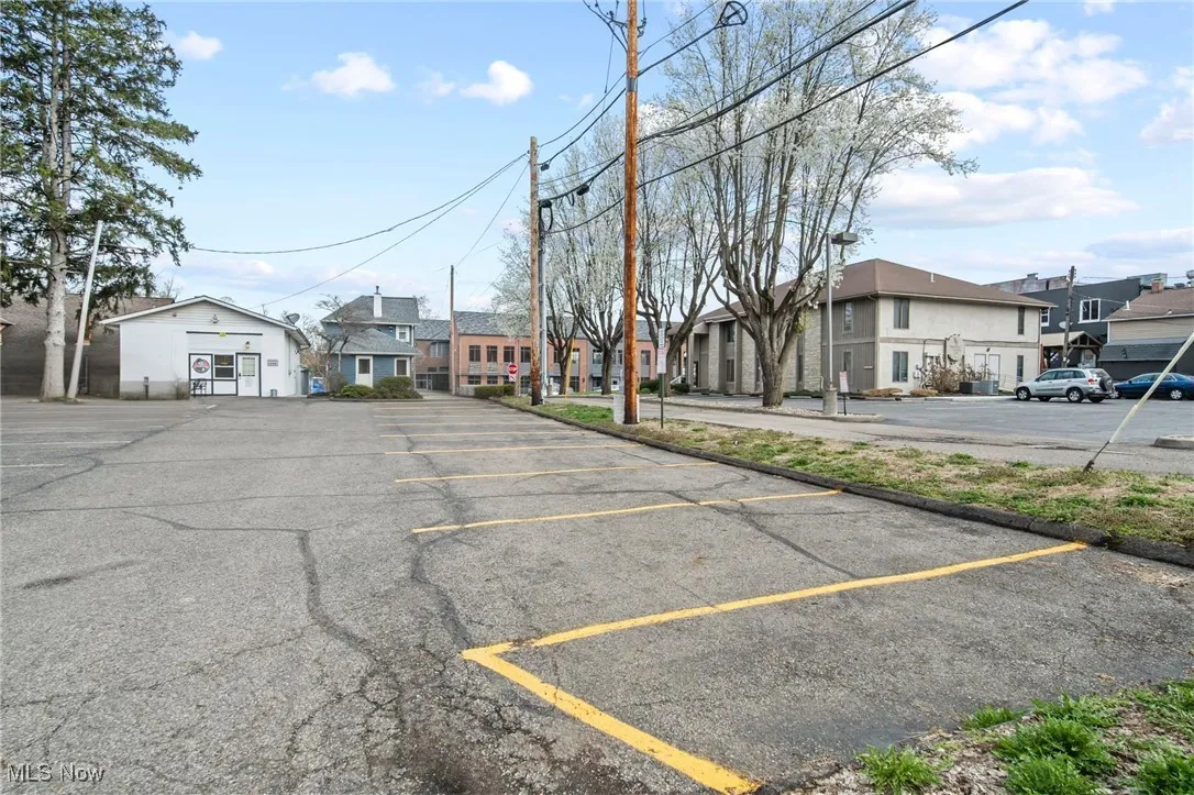 Uncovered parking lot with a residential view