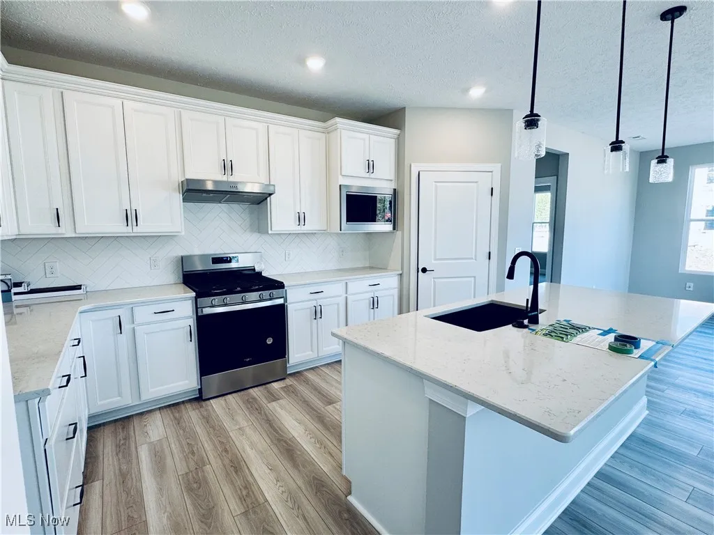 Large kitchen island overlooks the main living space