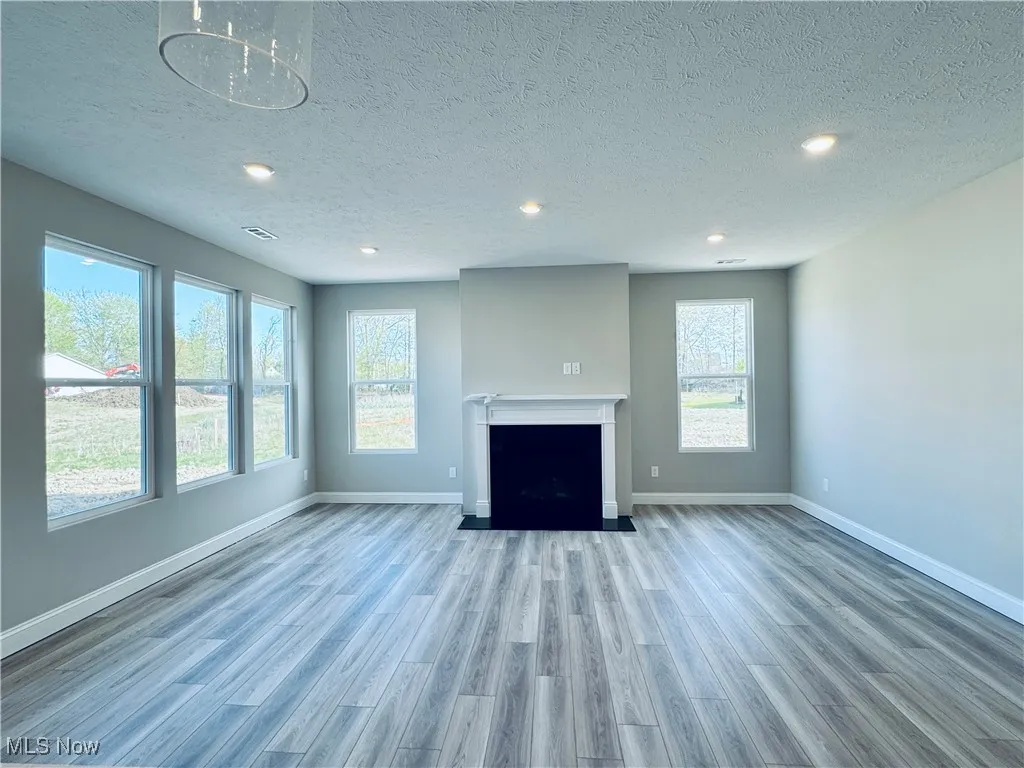 Plenty of natural light in the gathering room and a cozy gas fireplace to warm up the space