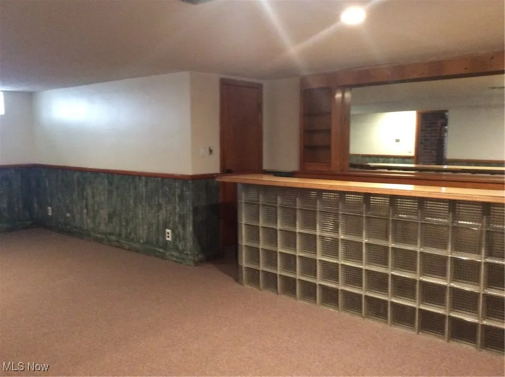 Finished basement with bar for entertaining