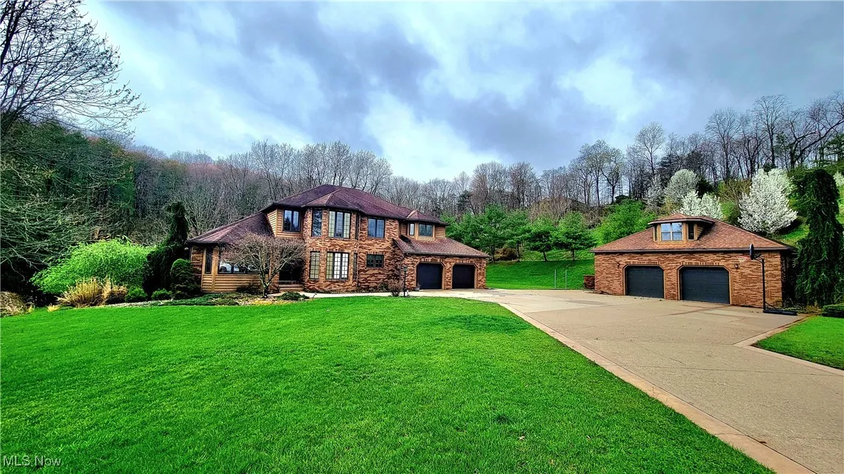 Sitting far back off a cul-de-sac, awaits an estate with a two car detached garage, in addition to the two car attached garage.
