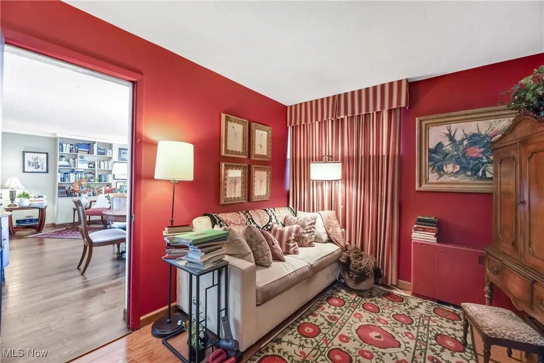 Living room featuring baseboards and light wood-style floors