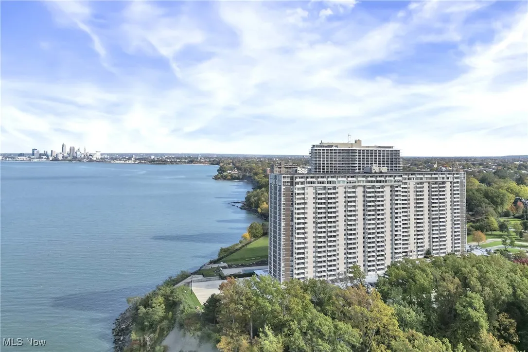 Aerial view featuring a water view and a view of city