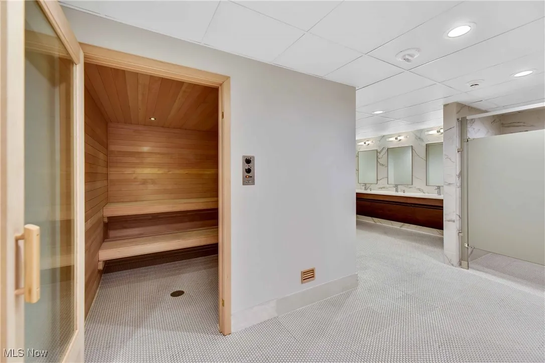 View of sauna with baseboards and recessed lighting